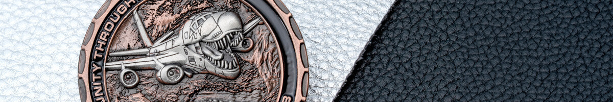 Antique copper Air Force challenge coin with a shark-mouth aircraft in 3D relief
