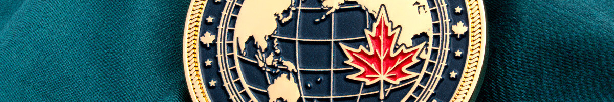 Indo-Pacific Engagement coin with a red maple leaf set over a gold and navy globe