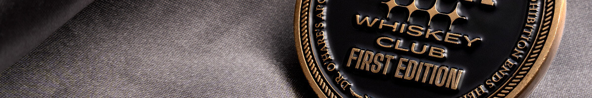 Black and gold whiskey club first edition membership coin