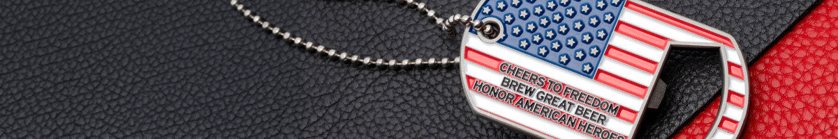Close-up of an American flag dog tag bottle opener coin on a ball chain
