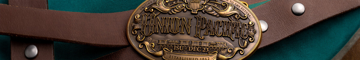 Union Pacific antique gold oval belt buckle on a brown leather belt