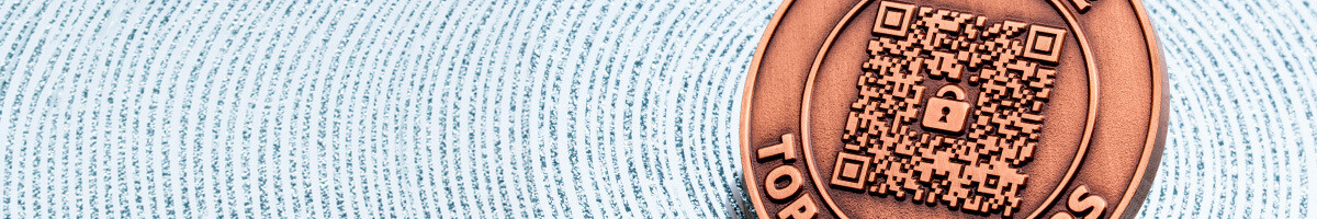 Antique copper challenge coin with a QR code and a padlock icon at its center