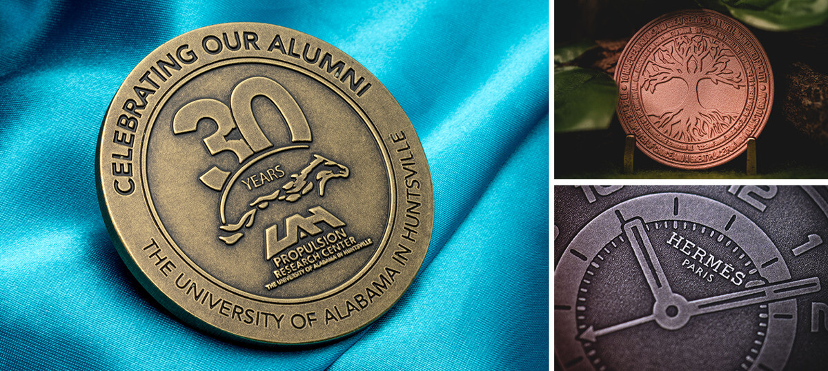 Three die struck coins: an antique brass University of Alabama in Huntsville 30-year alumni coin, an antique copper tree-of-life coin, and an antique steel Hermès Paris watch-face coin
