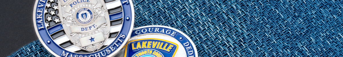 Lakeville Massachusetts Police Department challenge coins with a silver badge and a Courage and Dedication reverse