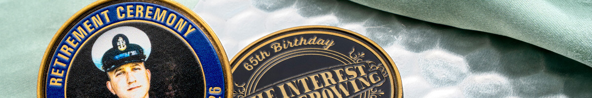 Navy retirement ceremony coin beside an antique gold semi-retirement coin