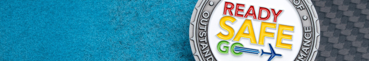 Close-up of a Ready Safe Go challenge coin awarded in recognition of outstanding safety performance