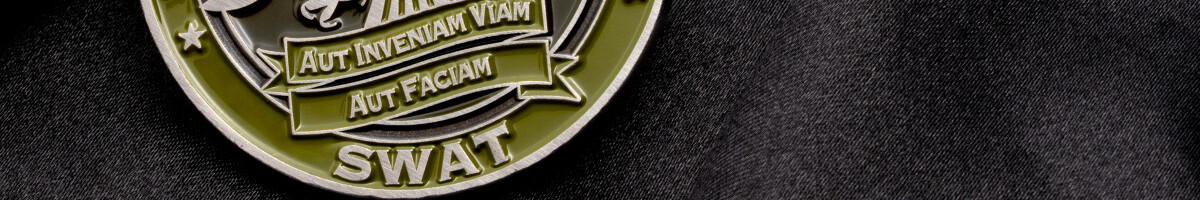 Close-up of an olive and antique silver Clinton Police SWAT coin showing the Aut Inveniam Viam Aut Faciam motto banner