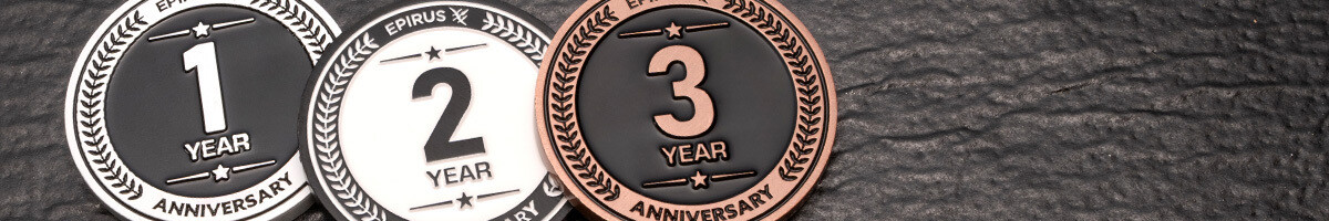 Epirus one, two, and three year anniversary coins in silver, white, and copper plating